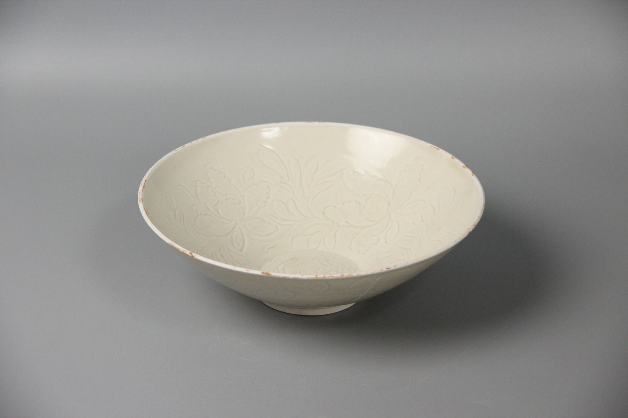 White glazed carved bowl
